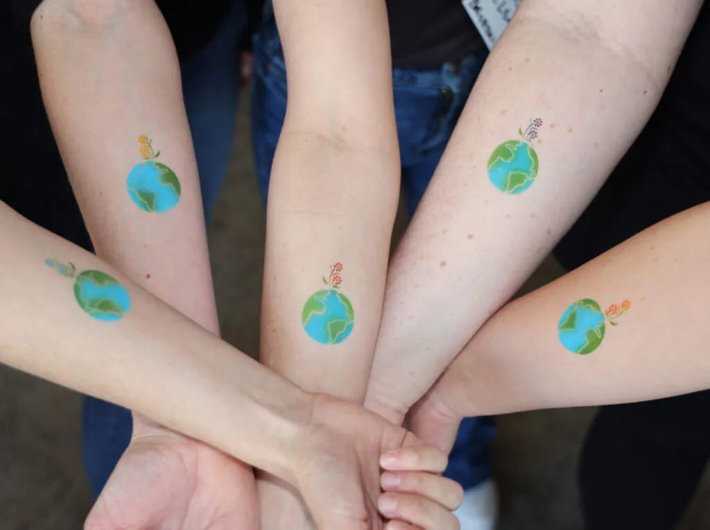 Photo of airbrushed earth tattoos for Earth Day!