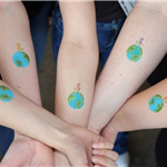 Photo of airbrushed earth tattoos for Earth Day!
