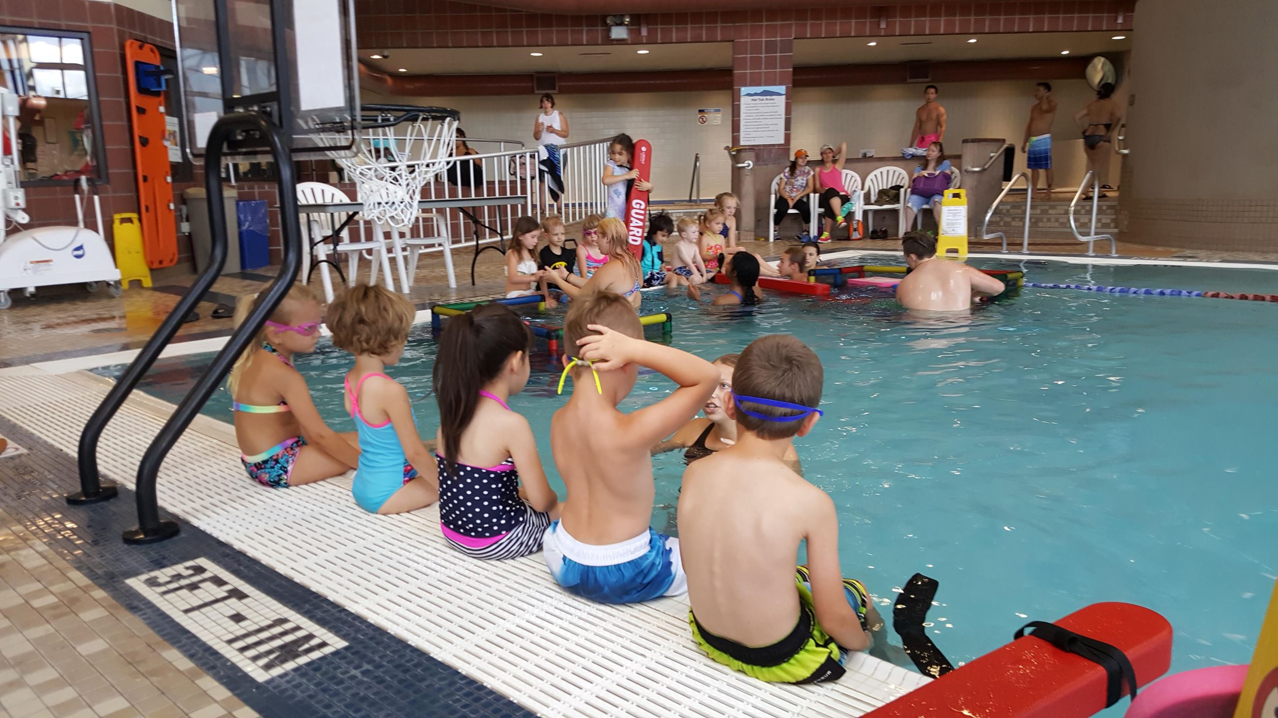 Instructor and children during a swimming lesson